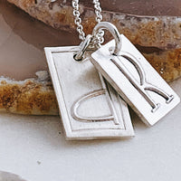 raised edge sterling initial necklace