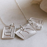 3 square initial charm necklace in silver
